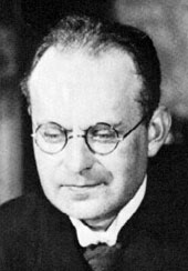 Photograph of Aaron Nimzowitsch seated at a chess board, circa 1930