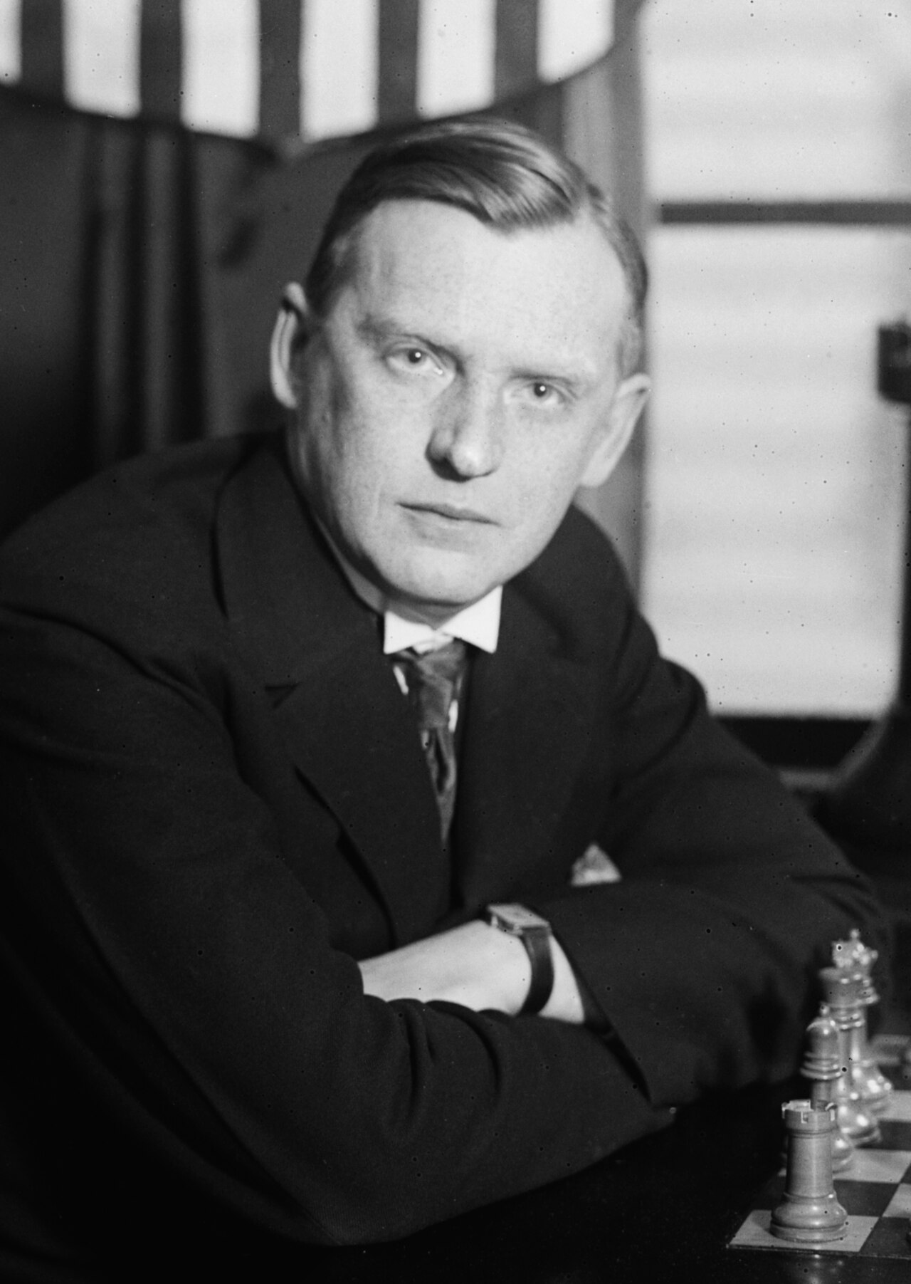 Photograph of Alexander Alekhine seated at a chess board, circa 1935