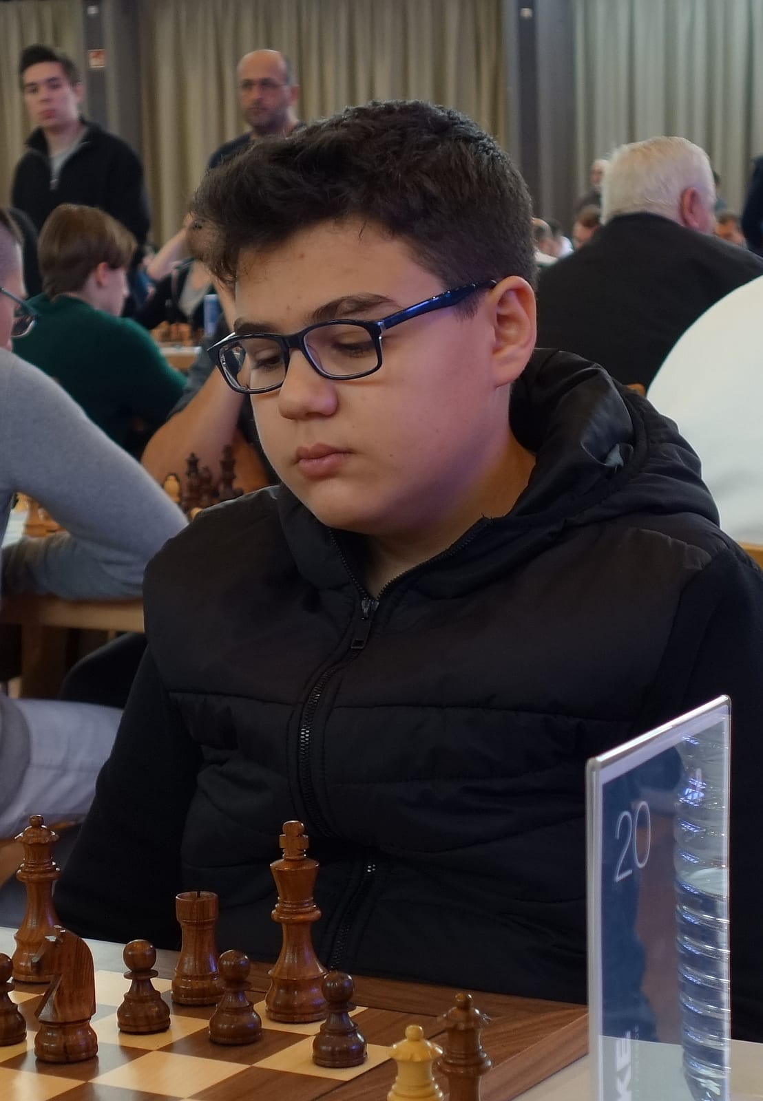 Yagiz Kaan Erdogmus concentrating at the board during a 2024 tournament