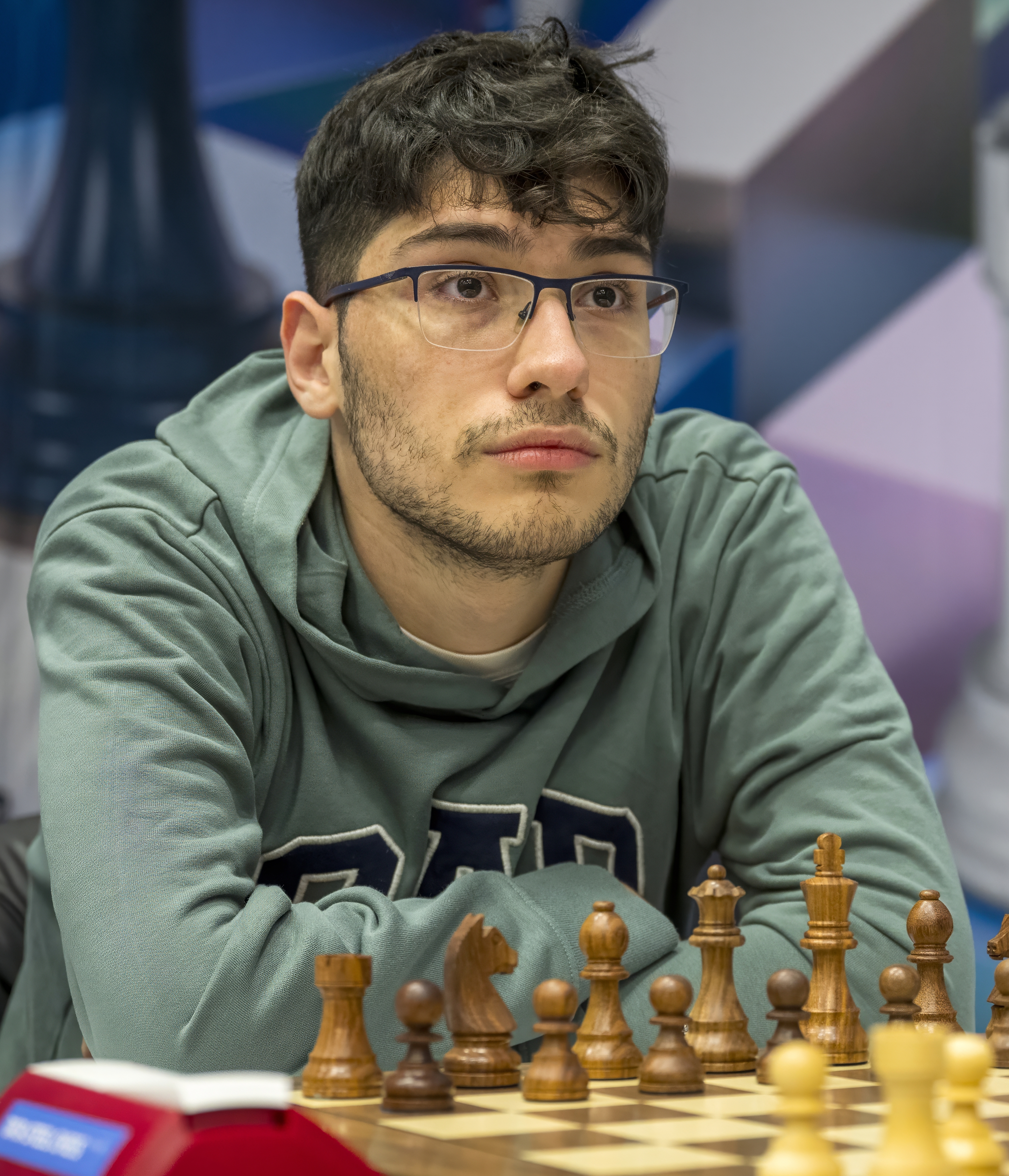 Alireza Firouzja calculating at a chess board during a tournament