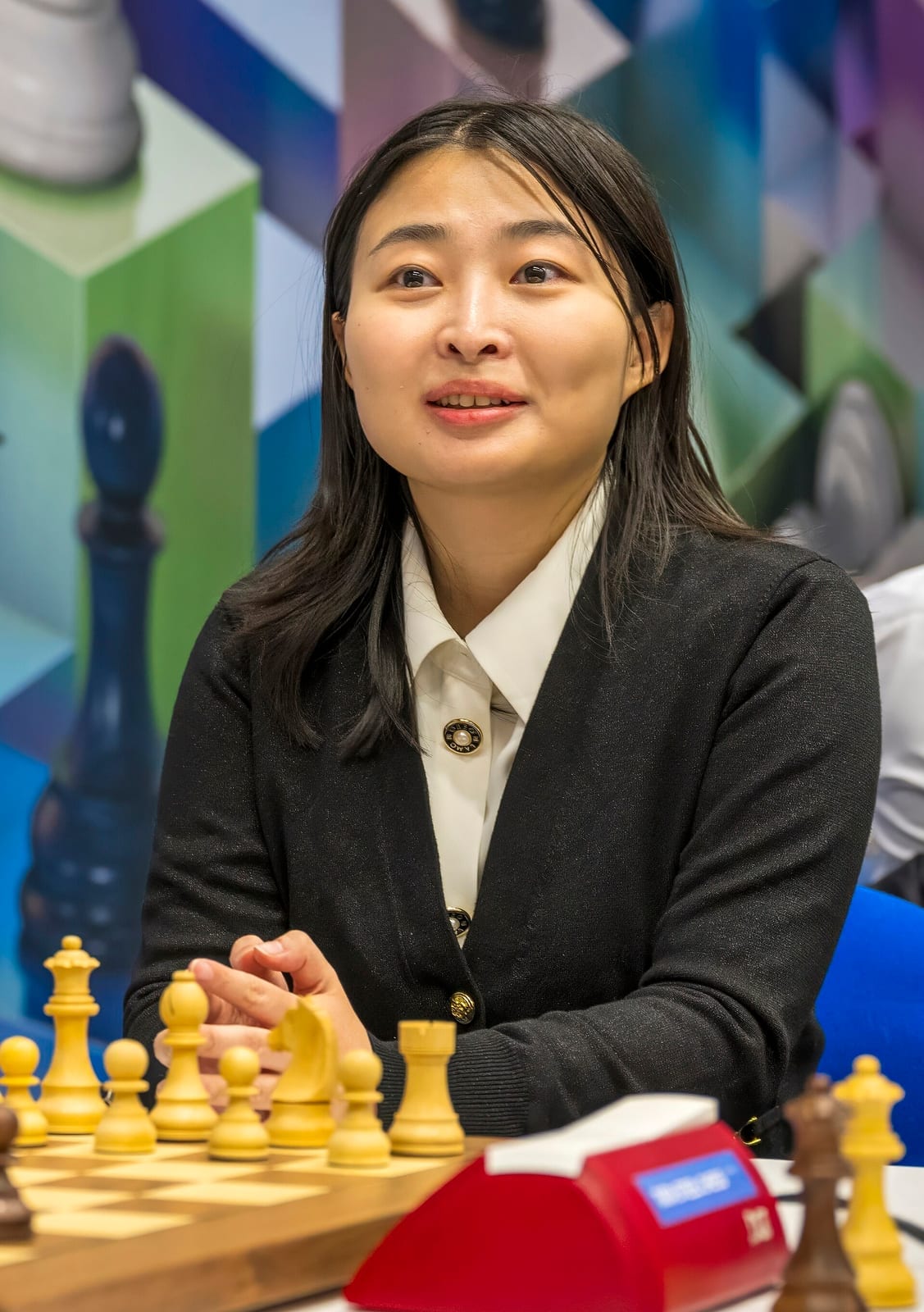 Ju Wenjun, five-time Women's World Chess Champion, at the board in 2024