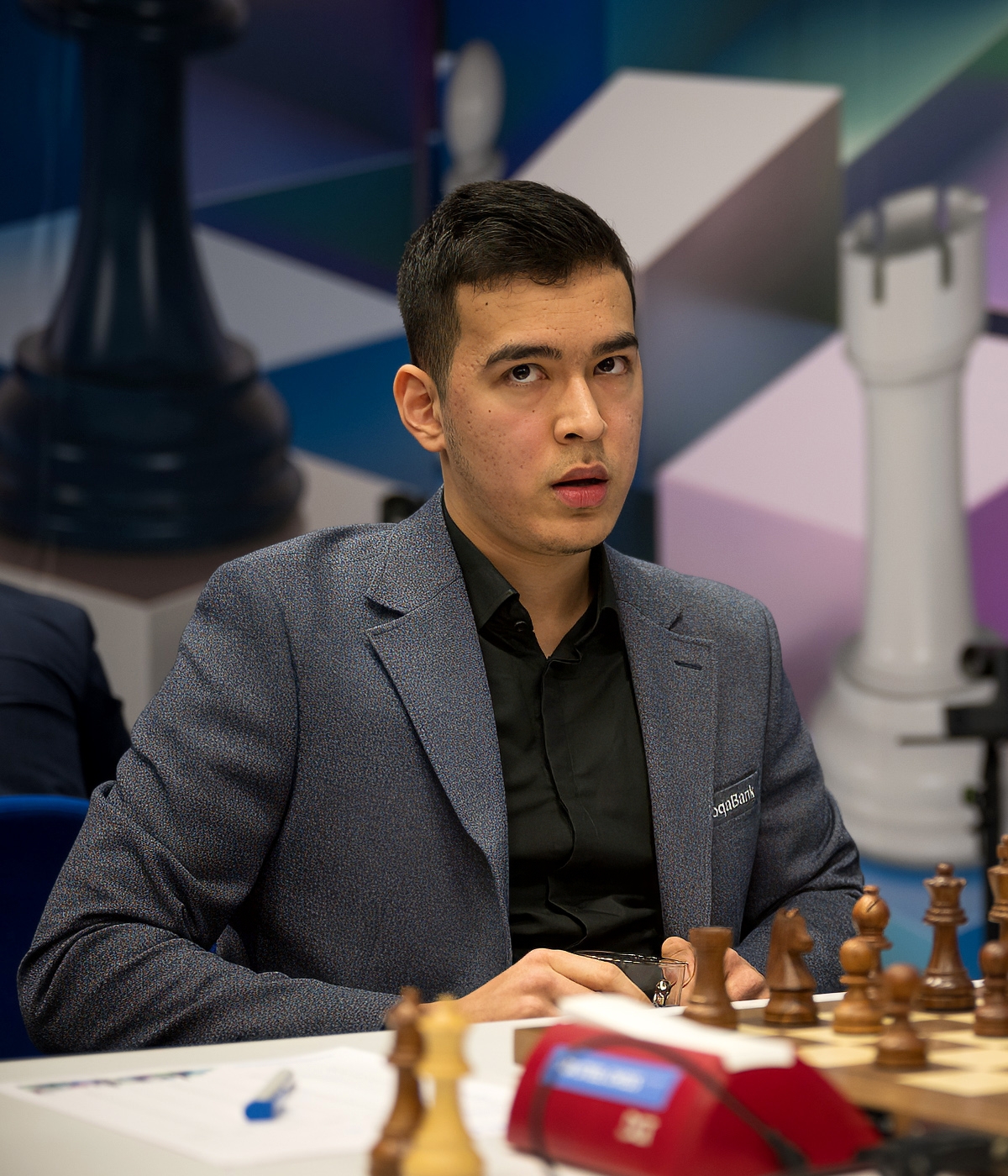 Nodirbek Abdusattorov at a chess tournament