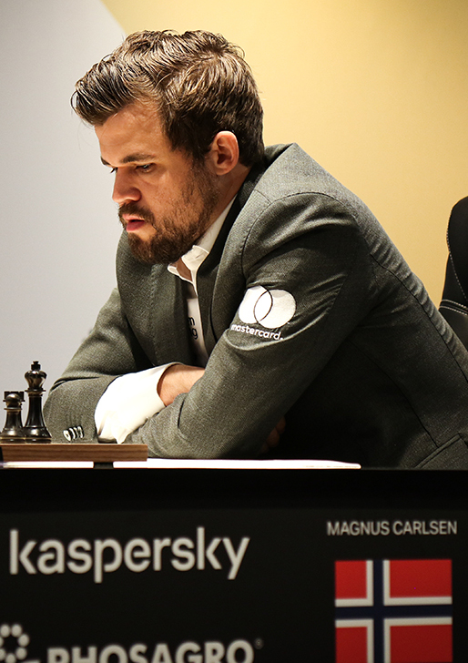 Two players competing at the World Chess Championship board